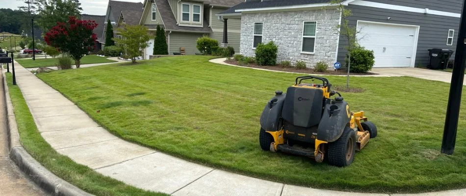 Mower on a manicured green lawn in Columbus, GA.