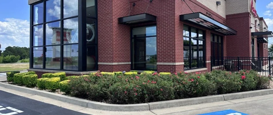 Chick-Fil-A in Columbus, GA, with maintained shrubbery.