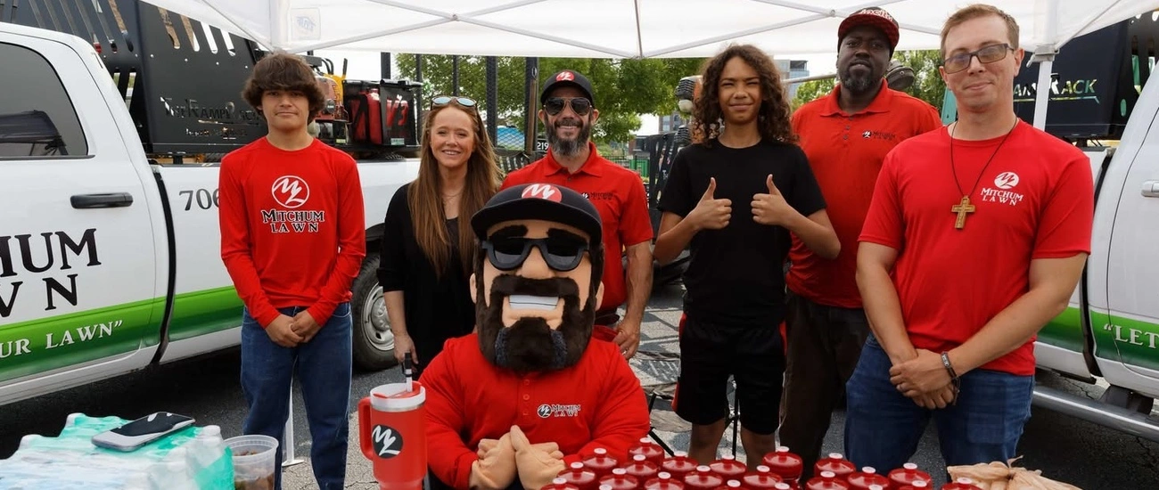 Team Photo Outdoors with Mitchum Lawn Hoodie Uniform